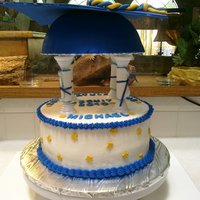 Graduation Cap All buttercream with fondant accents. Pillars are covered with fondant and made to look like diplomas.