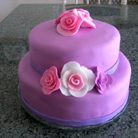 Mom's Fondant Gumpaste Rose Birthday Cake I made this for my Mom's birthday. It was my first attempt at making a totally fondant covered cake and first attempt at the roses....