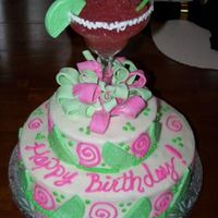 Margarita Cake Inspiration from a few different cakes on cc. strawberry cake w/ fresh strawberry filling and b/c icing. fondant bow and lime wedges....