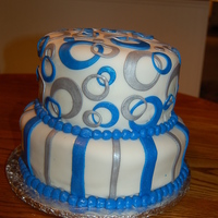 Electric Blue And Silver Wedding The wedding colres were electric blue and silver. We used the ends of tips mixed with circle cookie cutters to make the off set circles.