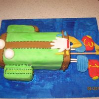 It's Tee-Off Tiem Golf Bag Cake Pound cake made with buttercream frosting rolled in fondant