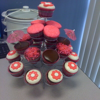 Chocolate Cupcakes Chocolate cupcakes with coconut icing for a coworkers birthday. The flowers are candy melts. I tinted coconut pink and use pink sanding...