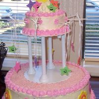 Twinkle, Twinkle, Little Star! This cake was made with a Whipped, Campagne flavored frosting and fondant cut outs.Thanks for viewing my cake!