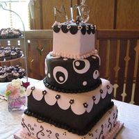 Megan & Brian's Brown & Pink Wedding Cake This cake was made for a very special friend. She wanted something a bit whimsical but not a wonky. She had some pictures that she kind of...