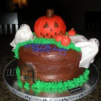 Halloween Cake this was so much fun. Four layer choc cake with choc/choc icing. The ghosts pumpkins, and grave stone are all fondant. the grave stone I...