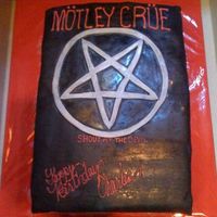 Motley Crue Poster Replicated a Motley Crue CD cover to make it look like a poster. I used black fondant for the first time (satin ice) it was a little soft...