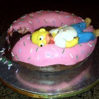 Homers Sick From The Doughnut! This was so much fun. I molded Homer all from fondant. The other side of him has him holding a coffee mug with coffee spilling out. Homer...