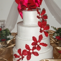 Jessica's Wedding Cake Fashioned after a Pink Cake Box cake. Gumpaste flowers and buttercream.