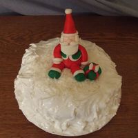 Santa Cake First cake using marshmallow fondant. This is a coconut cake with seven-minute frosting.