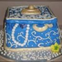 Jewelry Box I used 3 8" square cakes and covered them in fondant. I made the lid out of white chocolate and covered that in fondant as well, I don...