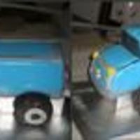 Chevy Truck I placed the cake on top of two L shaped pieced of trim forming the base then used hostess cakes as wheels whith little fondant accents.