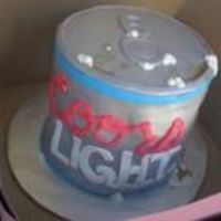 Beer Can This was made of 6 layers of 8" cakes covered in fondant and hand painted wth siver pearl dust.