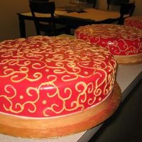 Gold Scrolls On Red. This cake was made for an anniversary. I covered all cakes in fondant, then I air brushed in red. I figured that would be the only way I...