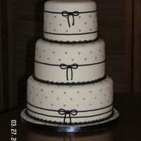 Gamma2.jpg White with black fondant celebration cake