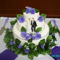 Wedding Cake With Gumpaste Roses This was my first time making gumpaste flowers. The brides colors were purple and silver, I outlined the rose petals with silver petal dust...