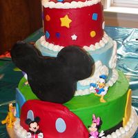 3 Tiers For Mickey Mouse Mickey Mouse clubhouse themed cake for my daughters 4th birthday party. Ordered the figures from the Disney store online. Buttercream with...