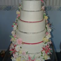 Eastern Idaho State Fair 2010 My first attempt at gumpaste flowers/shoe. The tier sizes are 18-16-14-12-10-8. I used an embossing mat on alternate tiers. I also added...