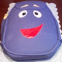 Dora's Backpack And Map This was for my cousin - what a Dora fan she is! Chocolate cake filled with custard and strawberries. Bottom of cake coated with milk...