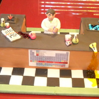 Mad Scientist THIS IS THE THIRD BIRTHDAY CAKE I'VE DONE FOR A FRIENDS SON. WHITE CAKE WITH FONDANT ACCENTS. THANKS FOR LOOKING & GOD BLESS.