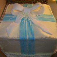 Square Gift Cake This is one of the cakes that went next to the larger birthday cake. Either white or chocolate with buttercream icing. Fondant accents.