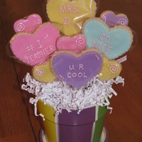 Conversation Hearts Bouquet First time doing rolled marshmallow buttercream icing. Was so easy to work with! Love it!! :)