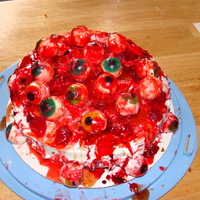 Eyeball Cake Me and my children made this cake for a friends bday party..halloween themed of course...we had a blast making it...she wanted it gory...