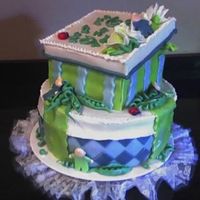 Sweet Pea In A Pod side view fondant covered cake, with fondant peas, babies, and sugar paste box top