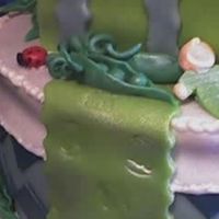 Sweet Pea In A Pod Detail of baby and peas made in fondant. Theme of baby shower was sweet peas.