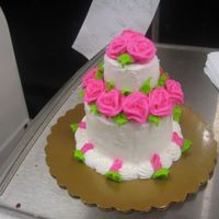 Cupcake Cake this is a regular sized cupcake w/ a mini cupcake on top.. buttercream icing