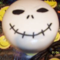Kia's 14Th Birthday Cake I used 2 - 8 inches rounds of chocolate cake with coconut filling. My daughter LOVES Nightmare Before Christmas & Jack Skellington!!...
