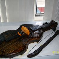 Violin Cake This didn't come out as well I'd hoped. Made it for a co-worker's son who plays violin. She loved it, I hope that he did too...