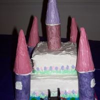 Princess Castle My VERY first attempt at a themed cake. White cake with raspberry filling and buttercream frosting. Tower bottoms made of fondant and tops...