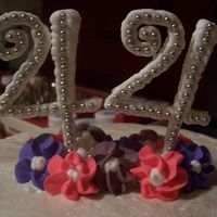 Cake Topper Just an up-close picture of the cake topper I made for my moms cake. Royal icing with silver dragees. I was really happy with how they...