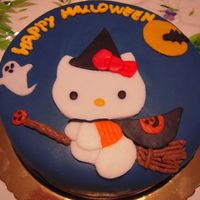 Hello_Kitty_Halloween.jpg Here's my halloween hello kitty cake, it's a chocolate cake filled with hazelnut buttercream and covered with sugar paste