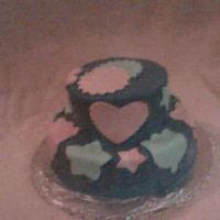 Birthday Cake 2 tiered cake with purple buttercream icing and mmf decorations. The colors were picked by my niece for her cake. First time using mmf,I...