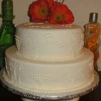 Wedding Cake This cake was a white cake with strawberrie cream as a filling. Realy good. Used royal icing to make the scroll work