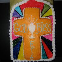 First Communion Cake I am a novice at cake decorating but wanted something especially from mom to my son. I took a 1/4 sheet and carved it into a church window...