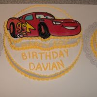 Cars Theme For a good friend's son... and a HUGE birthday party. The cake is a 16 inch with two 8 inch rounds next to it and cake under the car....