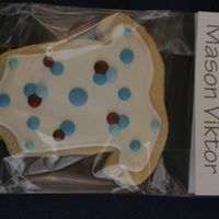 Onesie Cookies NFSC with RI. Decorated to match cake and invitations.