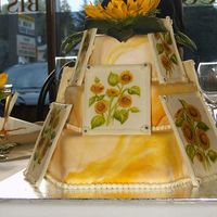 Sunflowers I made this for my niece's wedding. I marbled the fondant and then made gum paste "frames". My sister (an amazing artist)...