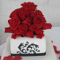Black White And Red Royal icing stencil and quilting with black pearls. Roses are all made with fondant and tylose and dusted with ruby petal dust. Drove this...