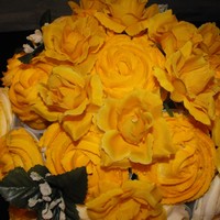 Yellow Rose Cupcake Bouquet My first attempt at a cupcake bouquet. There are 19 cupcakes in a wicker basket embellished with artificial yellow roses, leaves and baby...