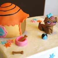 Littlest Pet Shop Cake Pet was made to look just like client's favorite pet. Fondant used for dog, accessories, dog house cover, and flowers. Hand painted...