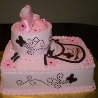 Baby Shower The bib and baby shoes are made of fondant.