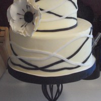Black, White And Cream My first dummy cake. Covered in fondant with gumpaste flower.