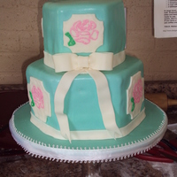 Vintage Bridal Shower White Almond cherry covered in fondant. Brush embroidery roses on panels. This was for a bridal shower.