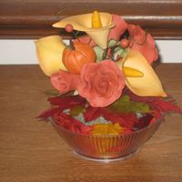 Gumpaste Fall Themed Floral Cake Topper My first attempt at working with gumpaste. This was a floral topper I made for my first ever wedding cake. It has roses, rosebuds, cala...