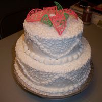 Two Tier Flower Cake This was my final cake for class. The flower on top is made of royal icing. I had tons of fun with this one!!!