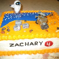 Wall-E Birthday Cake This is a chocolate chip cake with butter cream frosting. The rocks are chocolate pebbles and the trash piles are made of butter cream...