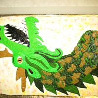 Dragon My daughter loves dragons and always wants one for her birthday caked. This dragon started as a stencil tracing that I transfered to the...